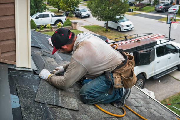 Professional Roofing technician working in Oakland Mills, PA